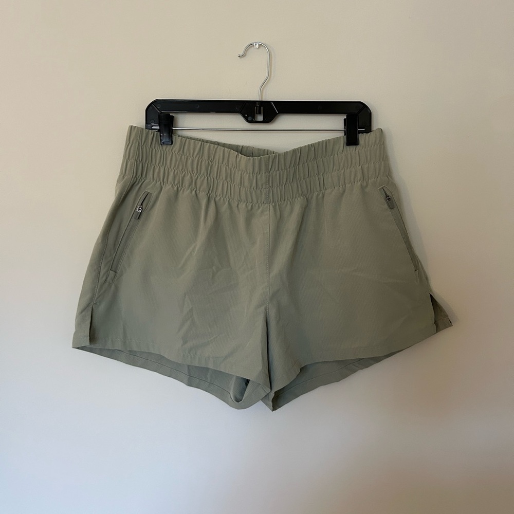 Green running shorts